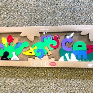 Dino Trio wooden puzzle.  Colorful.  3 puzzles.